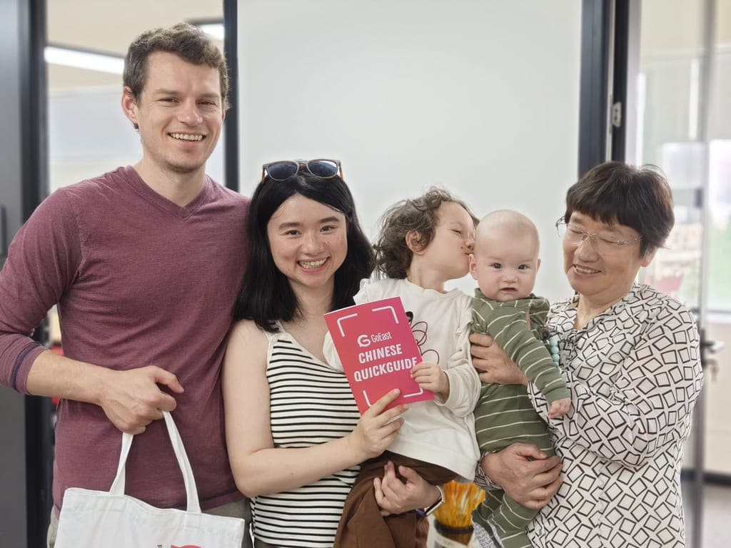 Multicultural family visiting GoEast Mandarin with their child