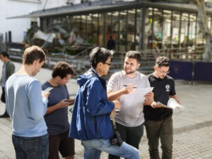 Brazilian school group exploring a local Shanghai neighborhood and chatting with residents