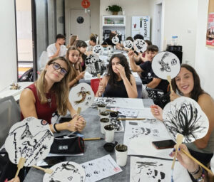 Italian school group showing their Chinese ink painting artwork
