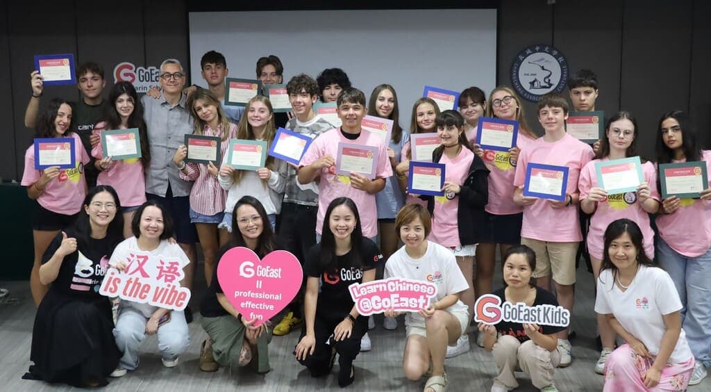 Italian school group graduation ceremony with teachers holding certificates at GoEast Kids