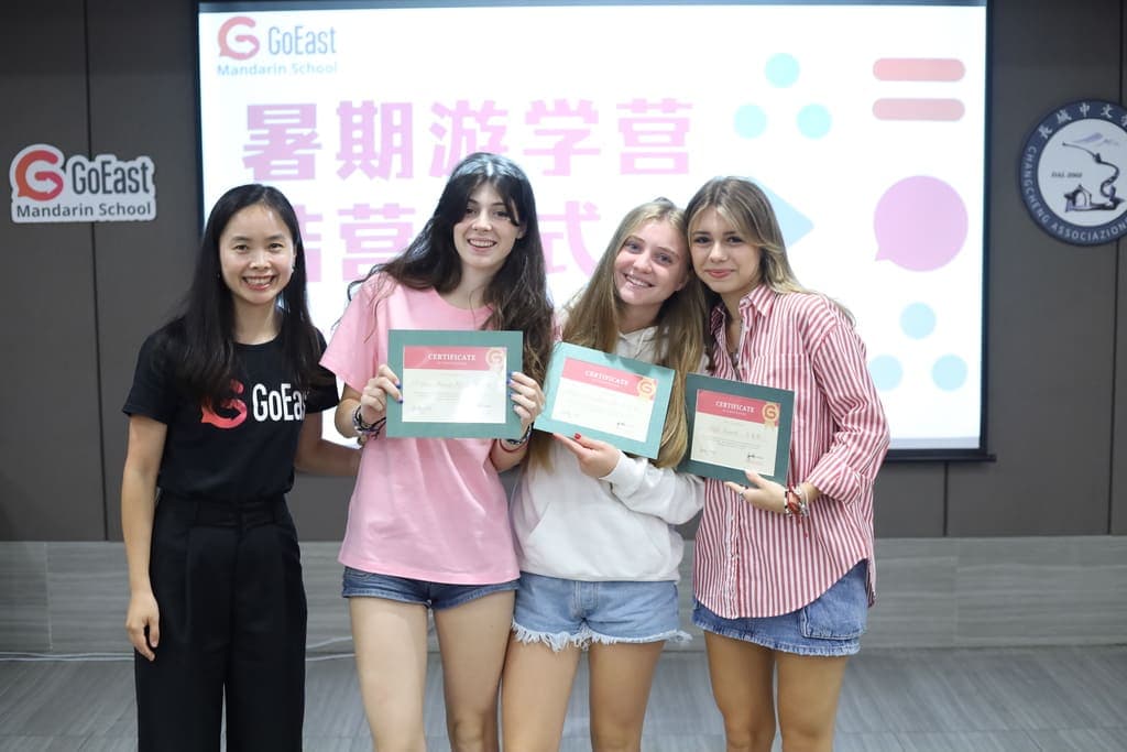 Italian school group graduation ceremony holding certificates at GoEast Kids