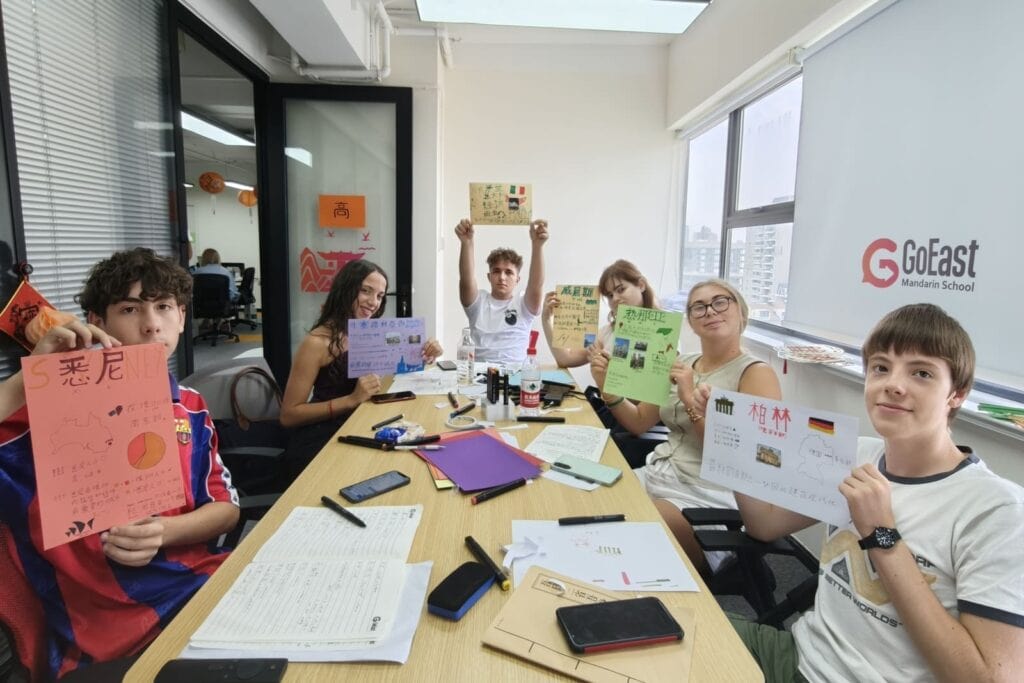 six kids taking chinese class during GoEast Kids summer camp 2025