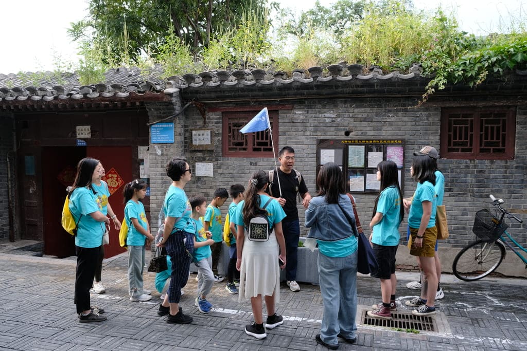 Young GoEast Kids students exploring a historic hutong alley in Beijing