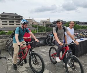 School trip students cycling on the ancient Xi'an City Wall