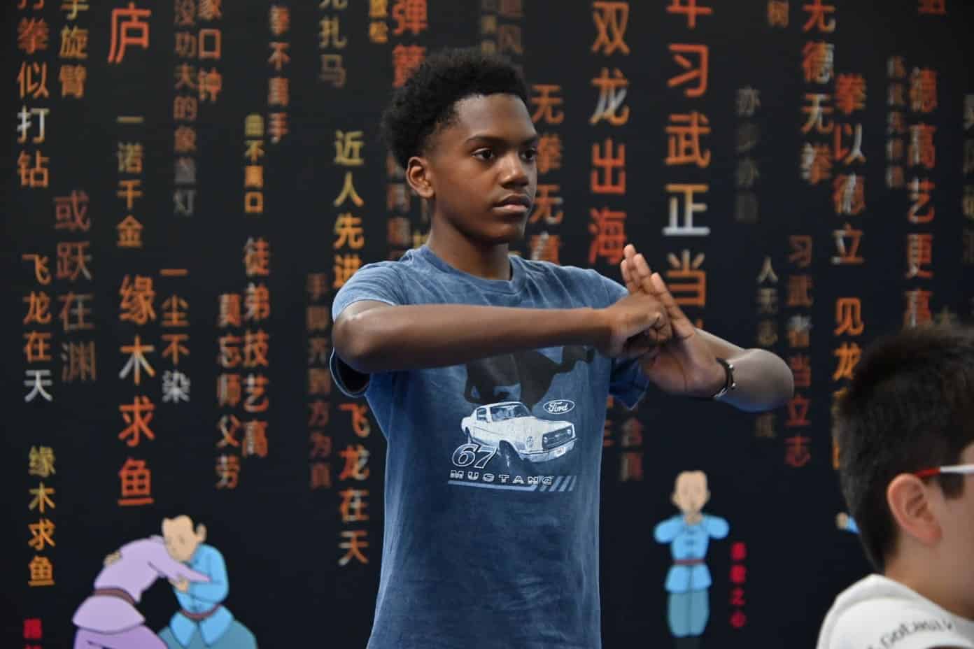 GoEast kids summer camp student Cameron joining Kung fu activity