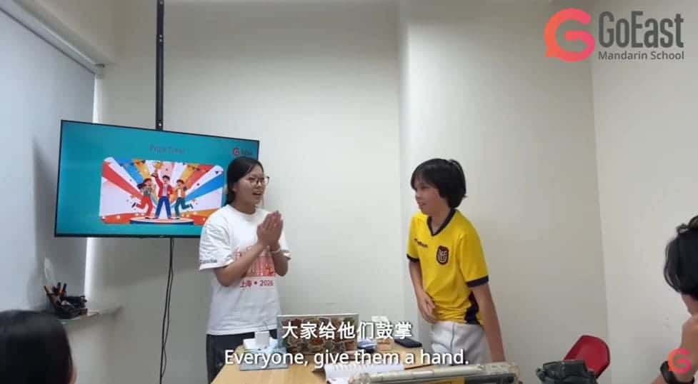 A teacher and three students in GoEast Kids Chinese camp
