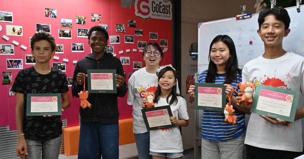 goeast kids-summer-camp- kids showing certificate