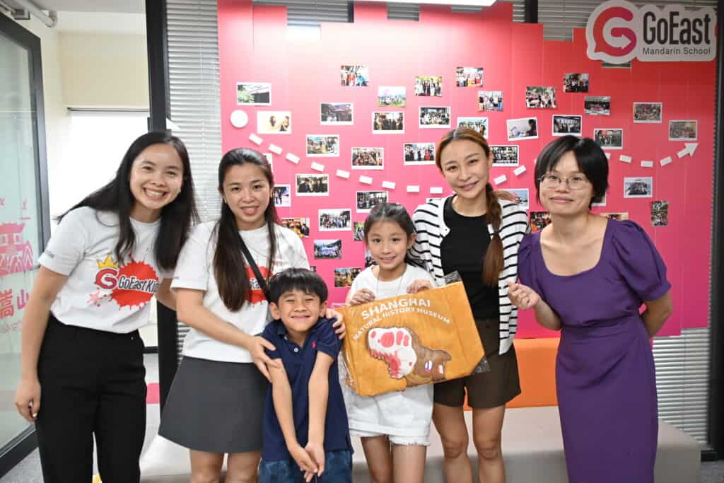 A camper's family with GoEast Kids teachers at the end of camp