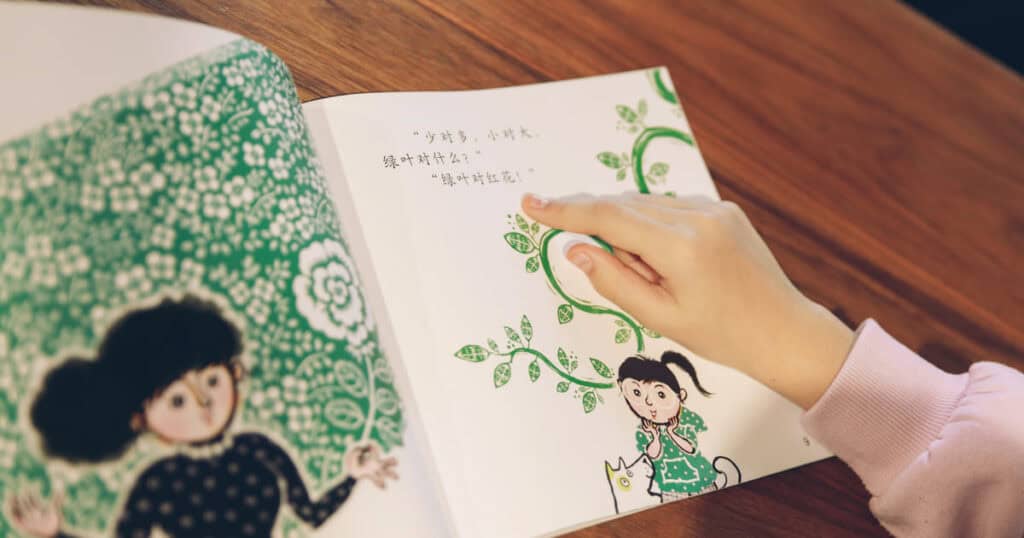 GoEast Kids student reading a Chinese book for kids